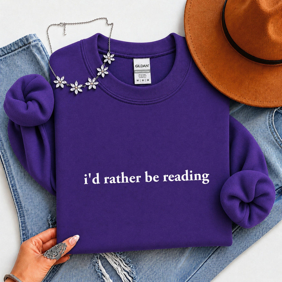May include an I’d Rather Be Reading Book Lover Sweatshirt featuring a classic reading-inspired statement design on a cozy pullover.