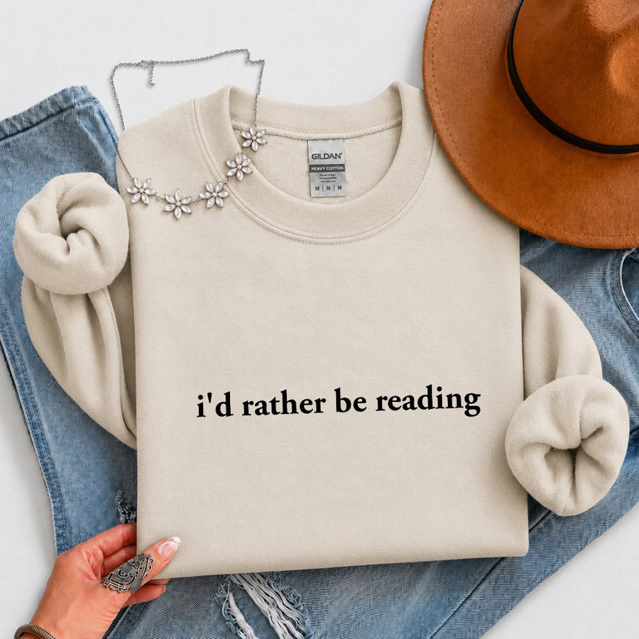 May include an I’d Rather Be Reading Book Lover Sweatshirt featuring a classic reading-inspired statement design on a cozy pullover.