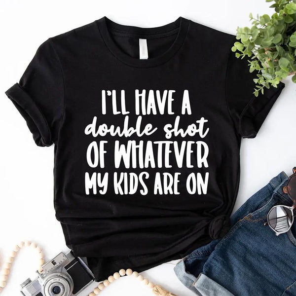 Black t-shirt with humorous text on I'll Have a Double Shot of Whatever My Kids Are On a white background with accessories.