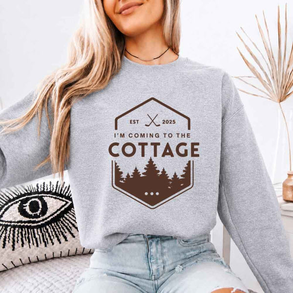 May include I'm Coming To The Cottage crewneck sweatshirt with reader-inspired graphic and cozy unisex fleece fit
