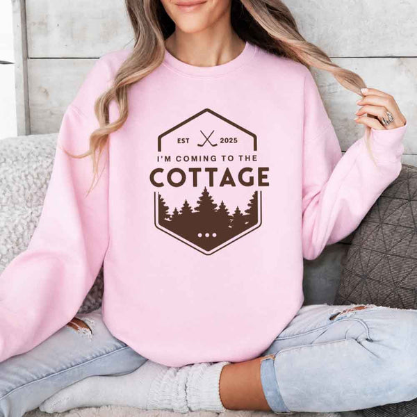 May include I'm Coming To The Cottage crewneck sweatshirt with reader-inspired graphic and cozy unisex fleece fit
