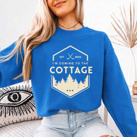 May include I'm Coming To The Cottage crewneck sweatshirt with reader-inspired graphic and cozy unisex fleece fit
