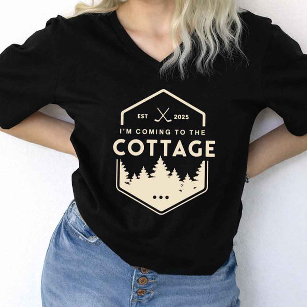May include I'm Coming to the Cottage v-neck tee with hockey romance BookTok graphic and relaxed unisex fit