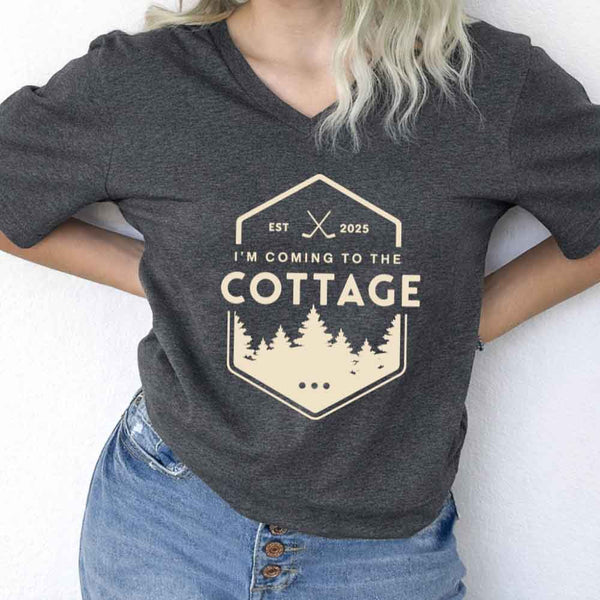 May include I'm Coming to the Cottage v-neck tee with hockey romance BookTok graphic and relaxed unisex fit