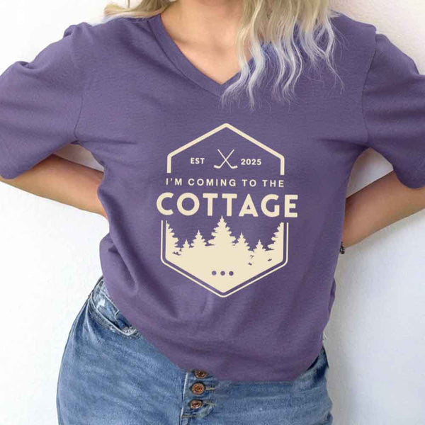 May include I'm Coming to the Cottage v-neck tee with hockey romance BookTok graphic and relaxed unisex fit
