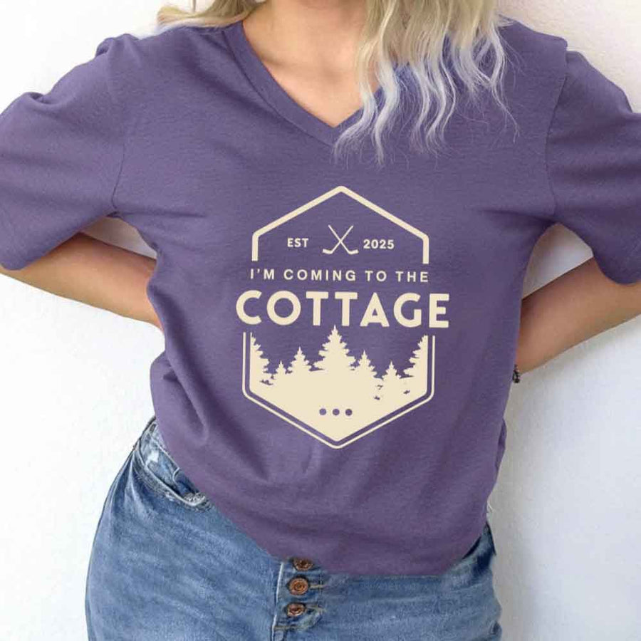 May include I'm Coming to the Cottage v-neck tee with hockey romance BookTok graphic and relaxed unisex fit
