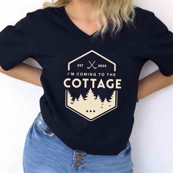 May include I'm Coming to the Cottage v-neck tee with hockey romance BookTok graphic and relaxed unisex fit