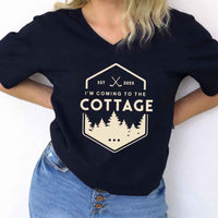 May include I'm Coming to the Cottage v-neck tee with hockey romance BookTok graphic and relaxed unisex fit