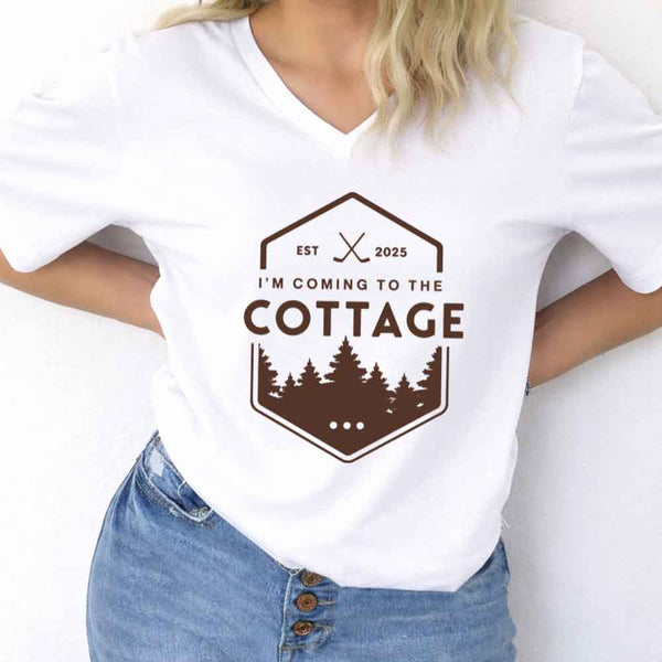May include I'm Coming to the Cottage v-neck tee with hockey romance BookTok graphic and relaxed unisex fit