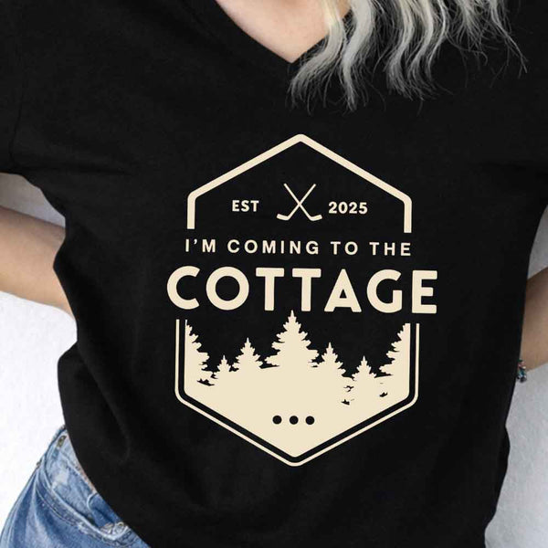 May include I'm Coming to the Cottage v-neck tee with hockey romance BookTok graphic and relaxed unisex fit