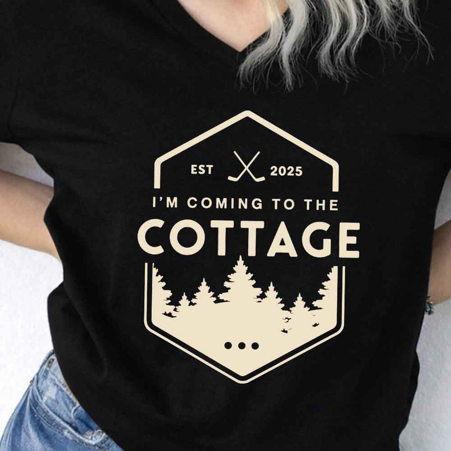 May include I'm Coming to the Cottage v-neck tee with hockey romance BookTok graphic and relaxed unisex fit