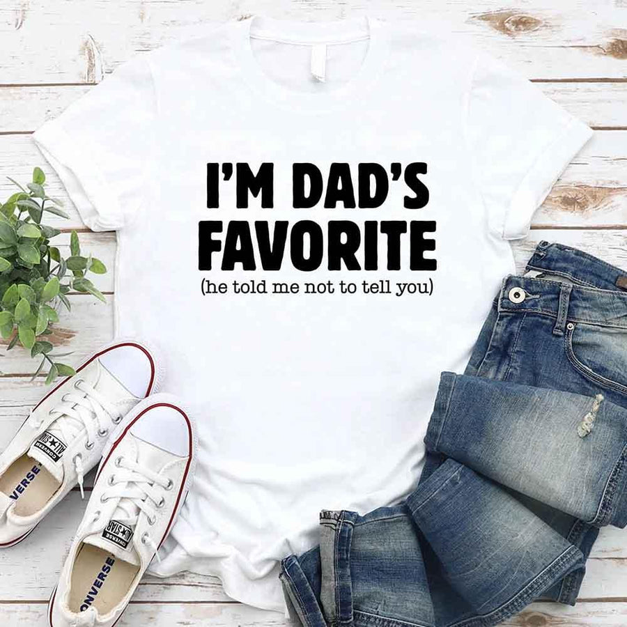 May include a unisex T-shirt with the phrase I’m Dad’s Favorite printed in a bold, humorous style.