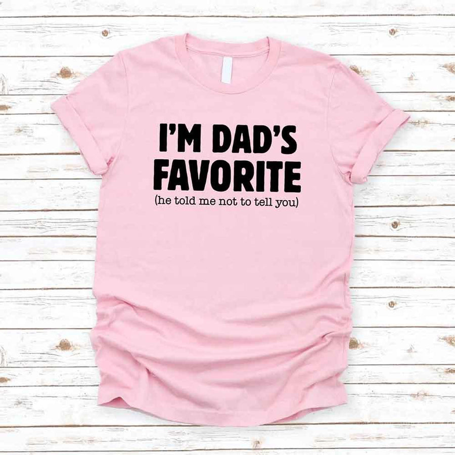 May include a unisex T-shirt with the phrase I’m Dad’s Favorite printed in a bold, humorous style.
