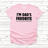 May include a unisex T-shirt with the phrase I’m Dad’s Favorite printed in a bold, humorous style.