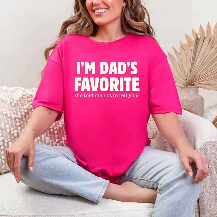 May include a unisex T-shirt with the phrase I’m Dad’s Favorite printed in a bold, humorous style.