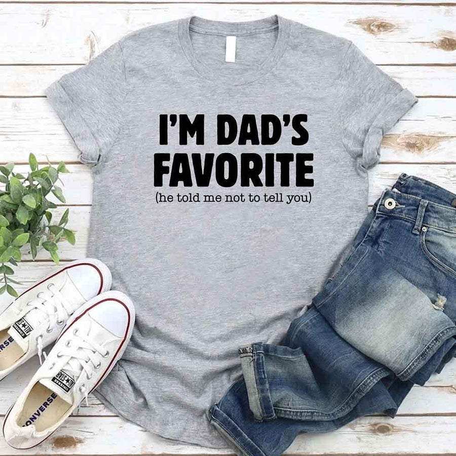 May include a unisex T-shirt with the phrase I’m Dad’s Favorite printed in a bold, humorous style.