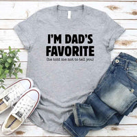 May include a unisex T-shirt with the phrase I’m Dad’s Favorite printed in a bold, humorous style.