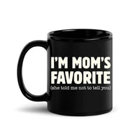 May include a ceramic coffee mug featuring the humorous phrase “I’m Mom’s Favorite” suitable for sons, daughters, and gifting.