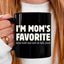 May include a ceramic coffee mug featuring the humorous phrase “I’m Mom’s Favorite” suitable for sons, daughters, and gifting.