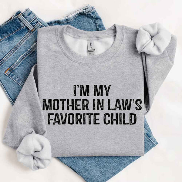May include a crewneck sweatshirt with the phrase I’m My Mother-In-Law’s Favorite Child printed on the front.