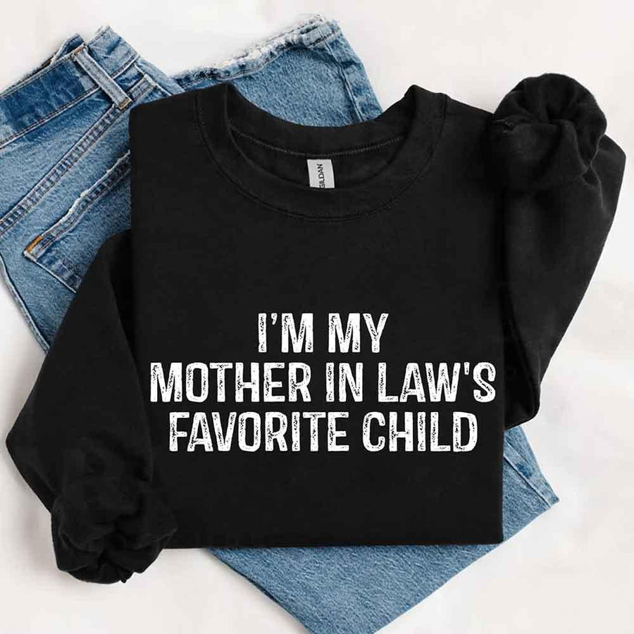 May include a crewneck sweatshirt with the phrase I’m My Mother-In-Law’s Favorite Child printed on the front.