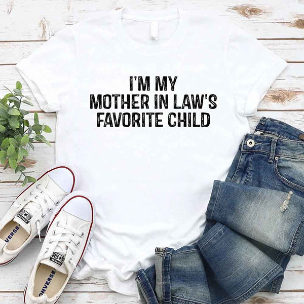May include a unisex t-shirt printed with the phrase “I’m My Mother-In-Law’s Favorite Child” in a humorous family design.