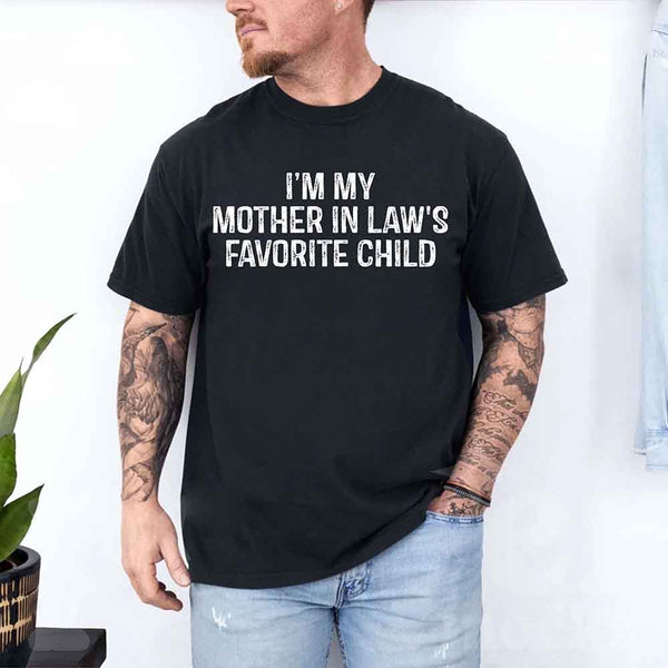 May include a unisex t-shirt printed with the phrase “I’m My Mother-In-Law’s Favorite Child” in a humorous family design.