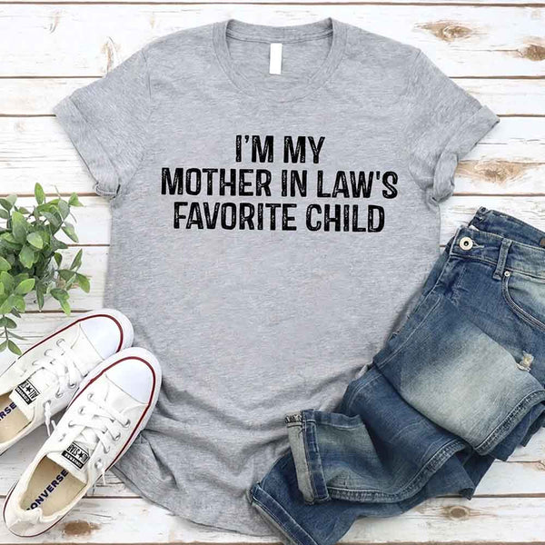 May include a unisex t-shirt printed with the phrase “I’m My Mother-In-Law’s Favorite Child” in a humorous family design.
