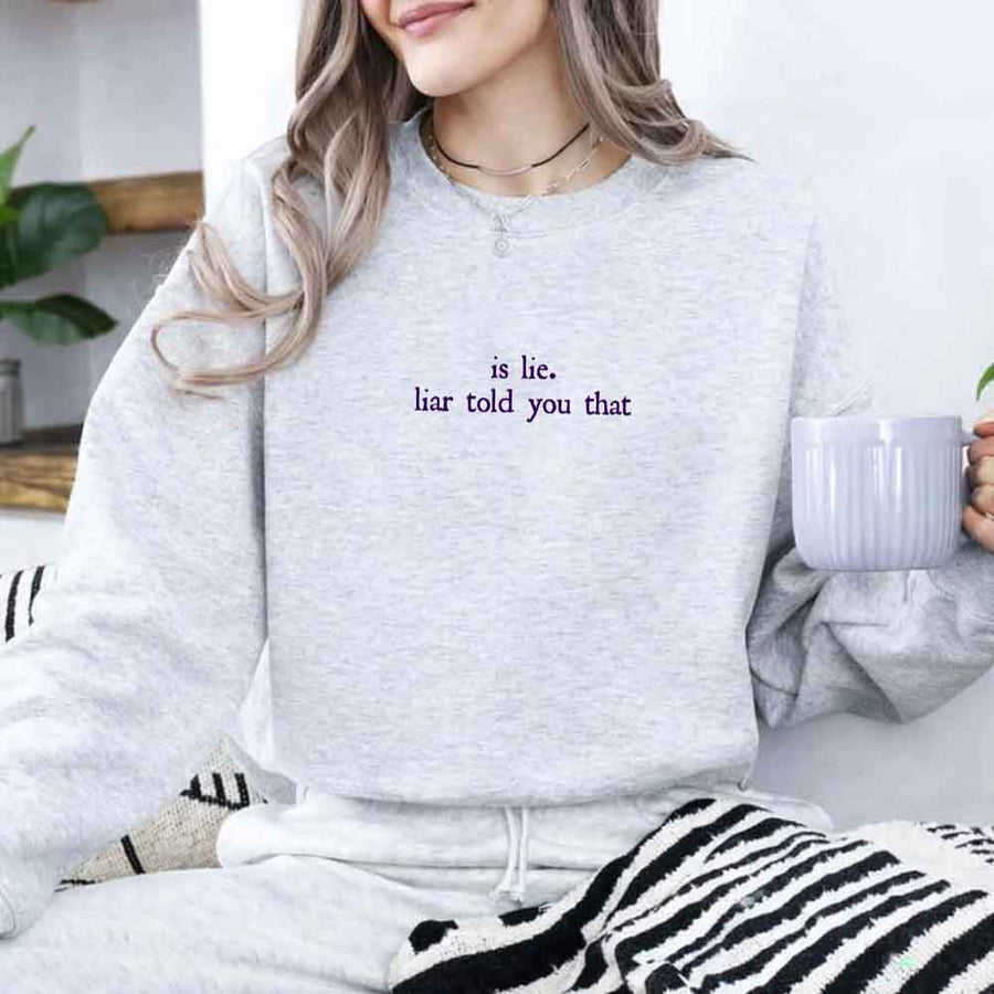 May include Is Liar Liar Told You That crewneck sweatshirt with relaxed fit rivalry inspired graphic design
