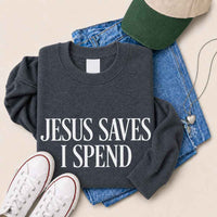 May include Jesus Saves I Spend sweatshirt with gospel inspired humor graphic design and relaxed unisex fit