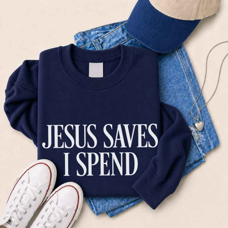 May include Jesus Saves I Spend sweatshirt with gospel inspired humor graphic design and relaxed unisex fit