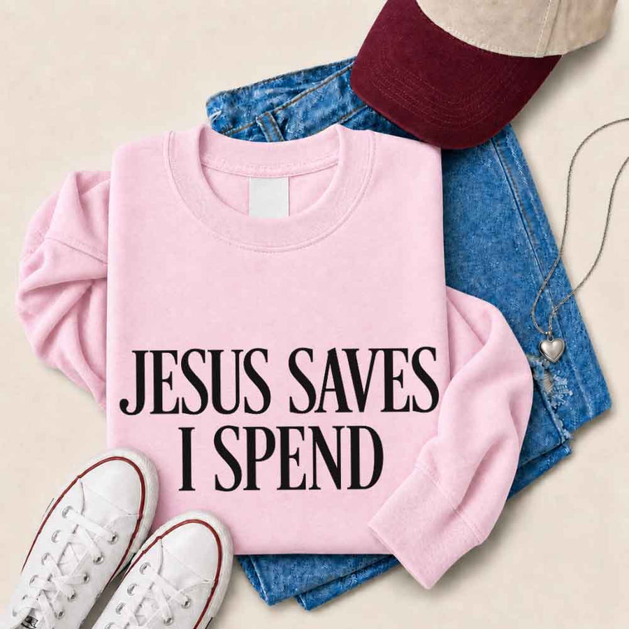 May include Jesus Saves I Spend sweatshirt with gospel inspired humor graphic design and relaxed unisex fit