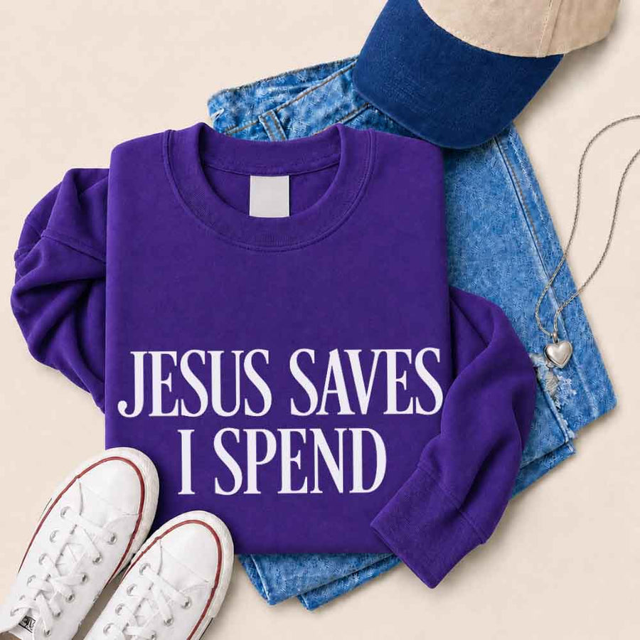 May include Jesus Saves I Spend sweatshirt with gospel inspired humor graphic design and relaxed unisex fit