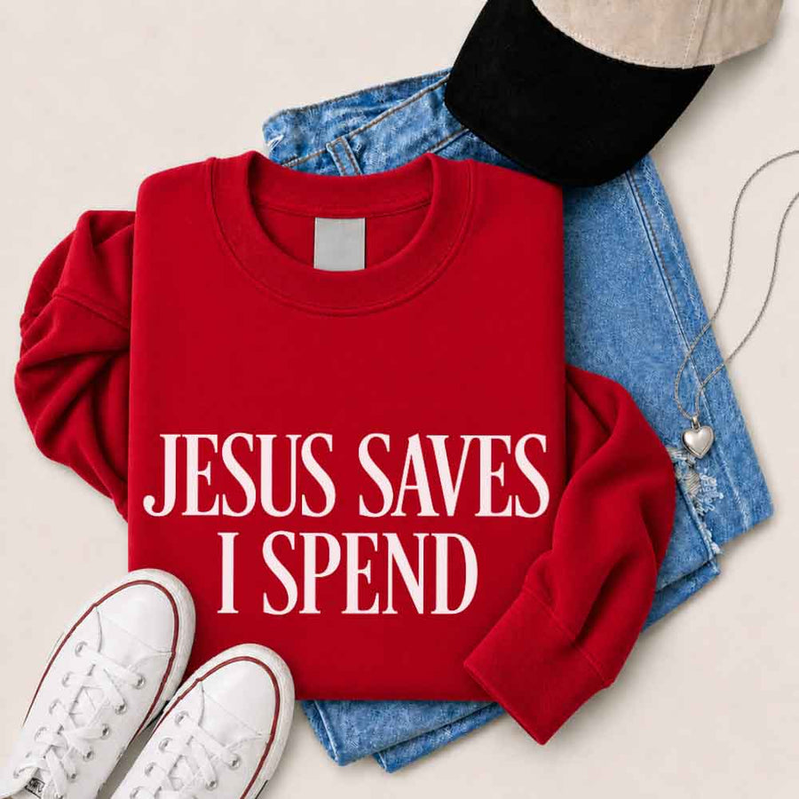 May include Jesus Saves I Spend sweatshirt with gospel inspired humor graphic design and relaxed unisex fit
