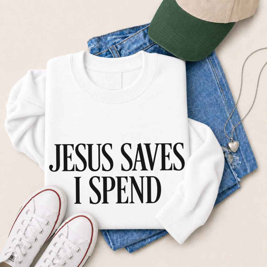 May include Jesus Saves I Spend sweatshirt with gospel inspired humor graphic design and relaxed unisex fit