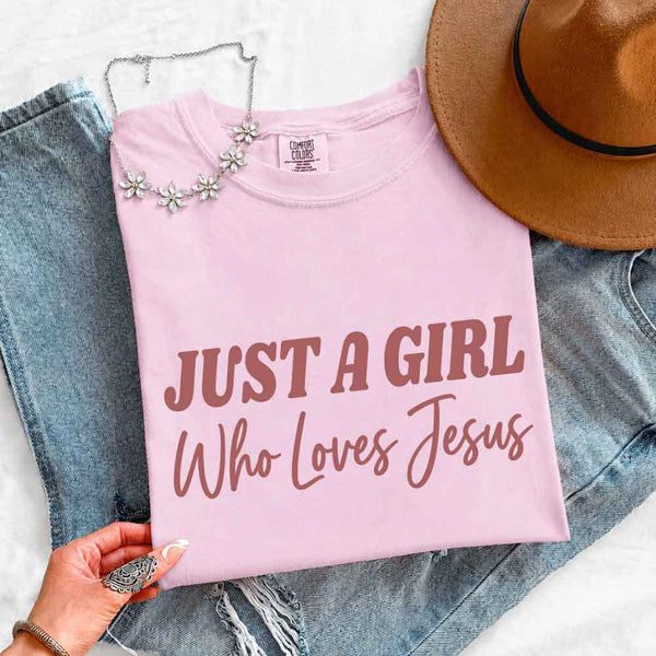 May include Just A Girl Who Loves Jesus Comfort Colors women’s faith graphic tee with relaxed fit design