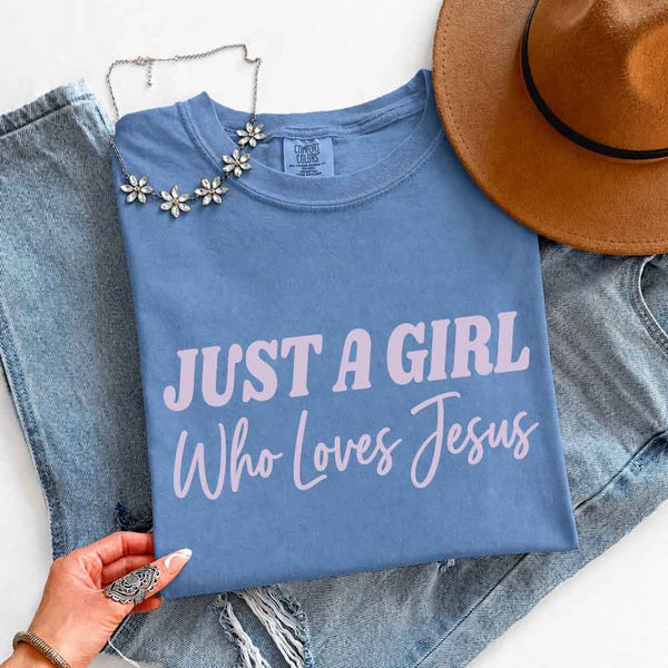 May include Just A Girl Who Loves Jesus Comfort Colors women’s faith graphic tee with relaxed fit design