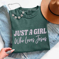 May include Just A Girl Who Loves Jesus Comfort Colors women’s faith graphic tee with relaxed fit design
