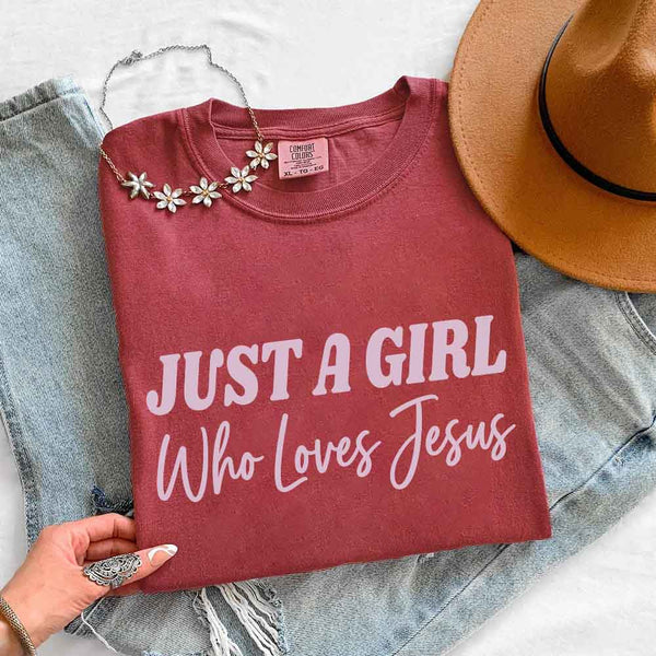 May include Just A Girl Who Loves Jesus Comfort Colors women’s faith graphic tee with relaxed fit design
