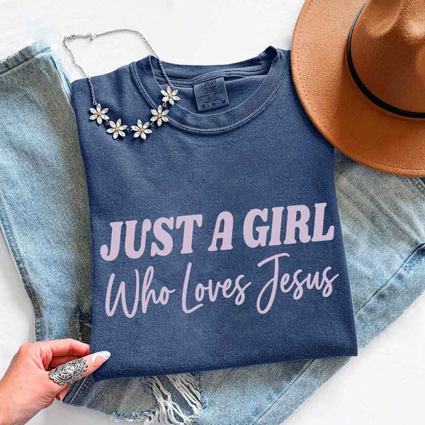 May include Just A Girl Who Loves Jesus Comfort Colors women’s faith graphic tee with relaxed fit design