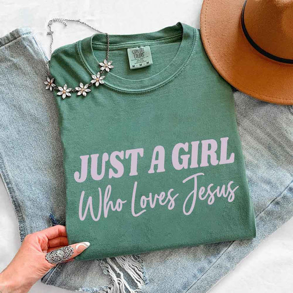 May include Just A Girl Who Loves Jesus Comfort Colors women’s faith graphic tee with relaxed fit design