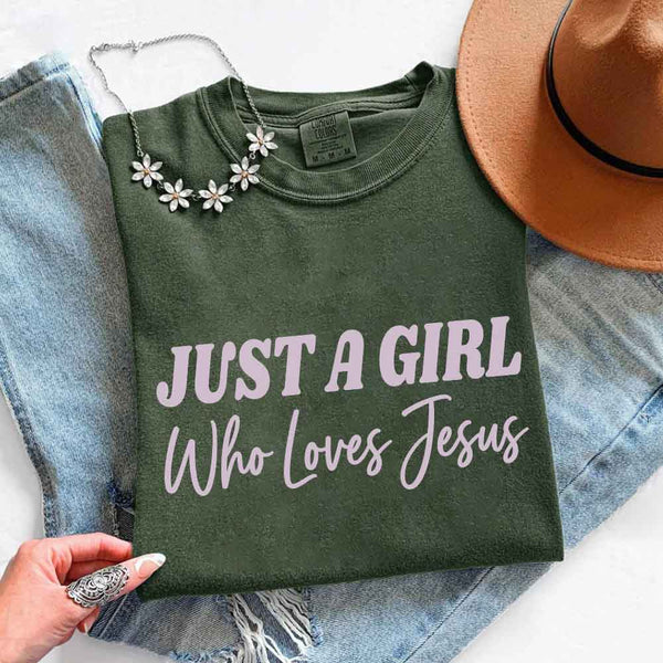 May include Just A Girl Who Loves Jesus Comfort Colors women’s faith graphic tee with relaxed fit design