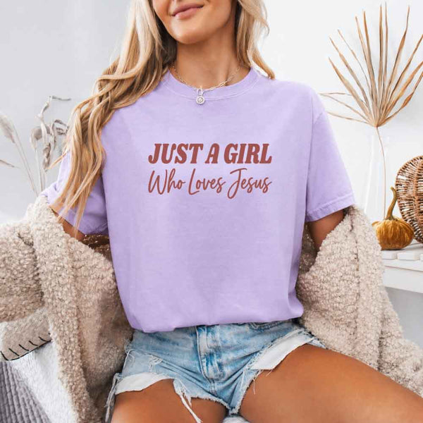May include Just A Girl Who Loves Jesus Comfort Colors women’s faith graphic tee with relaxed fit design