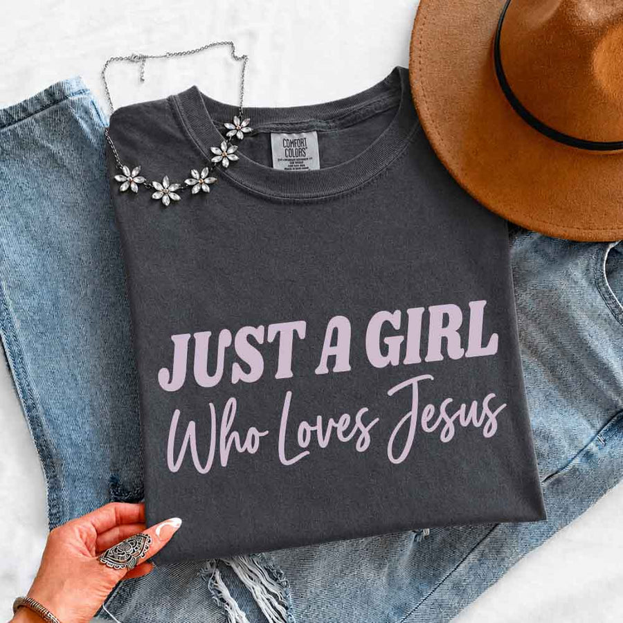 May include Just A Girl Who Loves Jesus Comfort Colors women’s faith graphic tee with relaxed fit design