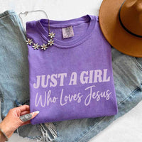 May include Just A Girl Who Loves Jesus Comfort Colors women’s faith graphic tee with relaxed fit design