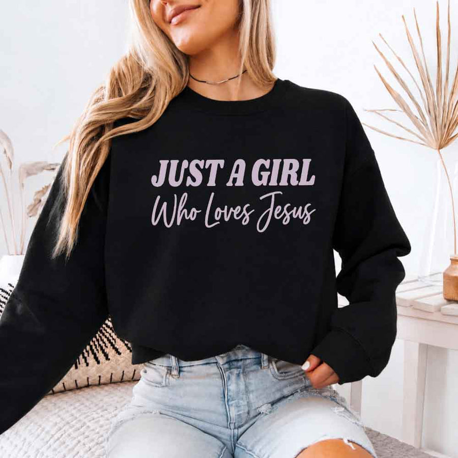 Just A Girl Who Loves Jesus sweatshirt with soft fabric, relaxed fit, and faith-based women’s design.