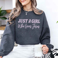Just A Girl Who Loves Jesus sweatshirt with soft fabric, relaxed fit, and faith-based women’s design.