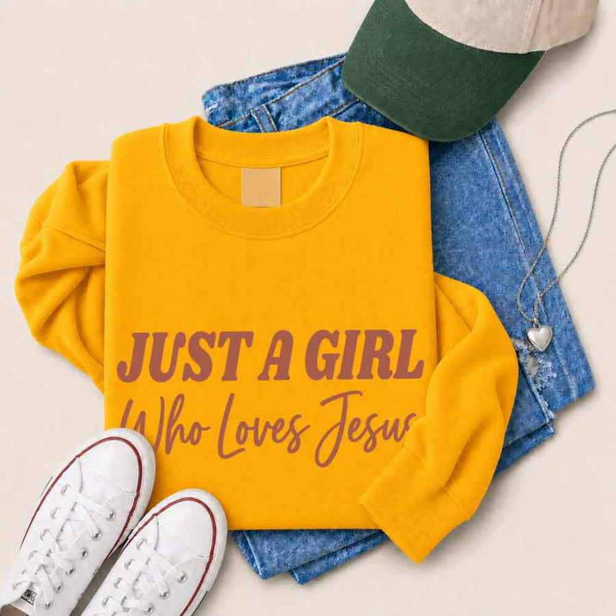 Just A Girl Who Loves Jesus sweatshirt with soft fabric, relaxed fit, and faith-based women’s design.