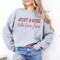 Just A Girl Who Loves Jesus sweatshirt with soft fabric, relaxed fit, and faith-based women’s design.