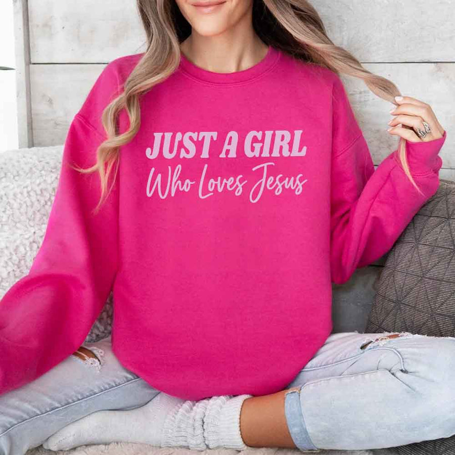 Just A Girl Who Loves Jesus sweatshirt with soft fabric, relaxed fit, and faith-based women’s design.
